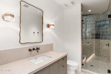 Perched high in the prestigious Tatum Canyon, this modern