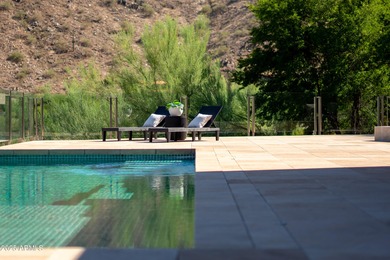 Perched high in the prestigious Tatum Canyon, this modern