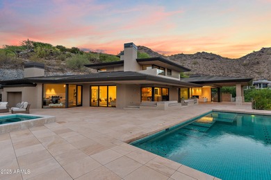 Perched high in the prestigious Tatum Canyon, this modern