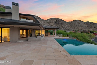 Perched high in the prestigious Tatum Canyon, this modern