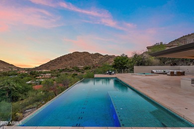 Perched high in the prestigious Tatum Canyon, this modern