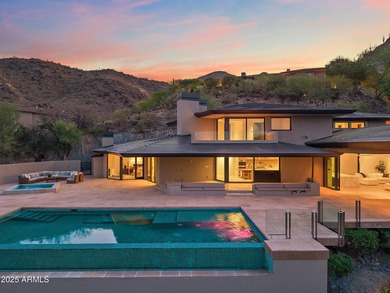 Perched high in the prestigious Tatum Canyon, this modern