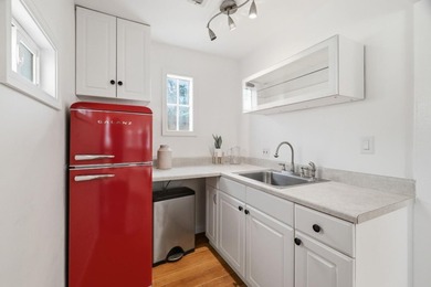 Ideally located on a quiet residential street in the highly - photo 13