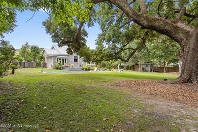 Tucked beneath a canopy of majestic live oaks on coveted Second - photo 8