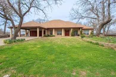 Beautiful home situated on the shores of Cedar Creek Lake awaits - Lake Home For Sale in Tool, Texas