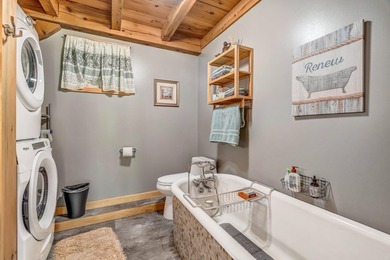 This stunning post-and-beam home on scenic Sennebec Pond offers - photo 32