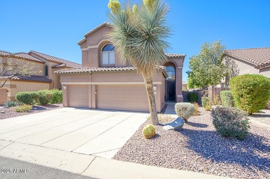 Gorgeous remodeled gated home in Las Sendas! Enter through the