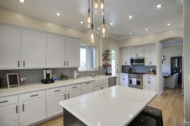 Gorgeous remodeled gated home in Las Sendas! Enter through the