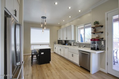 Gorgeous remodeled gated home in Las Sendas! Enter through the