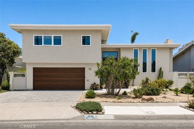 Situated in the coveted Huntington Harbour community, this - photo 1