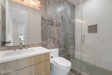 An elegant 8 bedroom, 5 bathroom coastal residence with a - photo 13