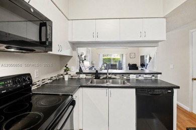 RARELY AVAILABLE CORNER UNIT! Charming 2 bedroom, 2.5 bath - photo 5