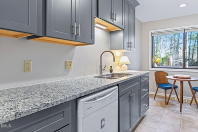 Beautifully updated end-unit townhome offering 3 bedrms & 3 full