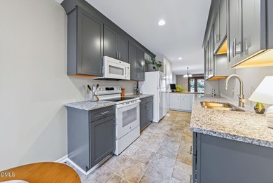 Beautifully updated end-unit townhome offering 3 bedrms & 3 full