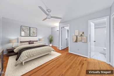 Beautifully updated end-unit townhome offering 3 bedrms & 3 full