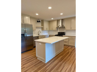 Completely rebuilt & renovated from the studs up, this - photo 6