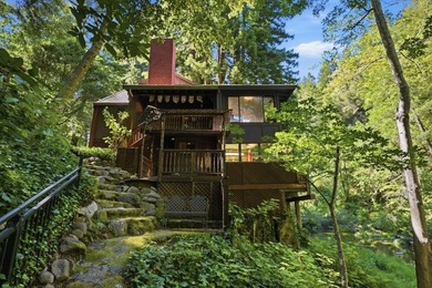 An enchanting riverside retreat awaits you in Brookdale. This - photo 2