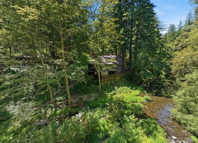 An enchanting riverside retreat awaits you in Brookdale. This - photo 7