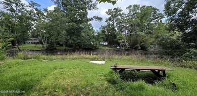 HALF Acre lot with 4Ft of water access to Trout River. SELLER - photo 3