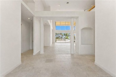 Framed by swaying palms and endless water views, this estate - photo 11