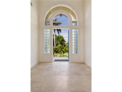 Framed by swaying palms and endless water views, this estate - photo 12