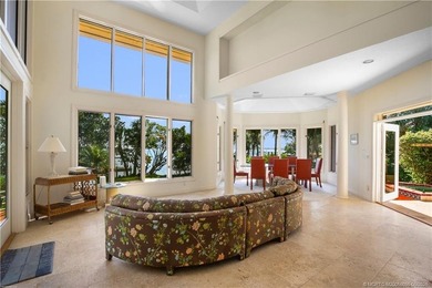 Framed by swaying palms and endless water views, this estate - photo 15