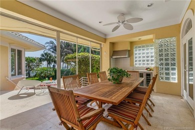 Framed by swaying palms and endless water views, this estate - photo 25