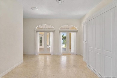 Framed by swaying palms and endless water views, this estate - photo 26