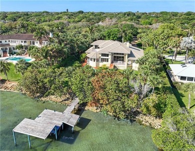 Framed by swaying palms and endless water views, this estate - photo 30
