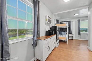 Discover a rare waterfront retreat where coastal living comes - photo 4