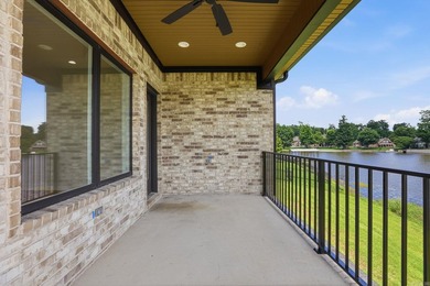 Wake up each day to breathtaking lake views in this exceptional - photo 31
