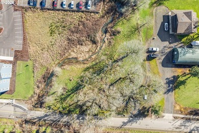 Enjoy 1.15 level acres with a creek running through it, right in - photo 3
