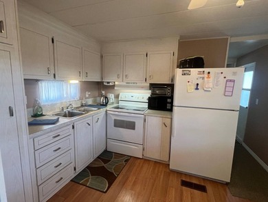 This energetic 55+ community blends an active lifestyle with - photo 8