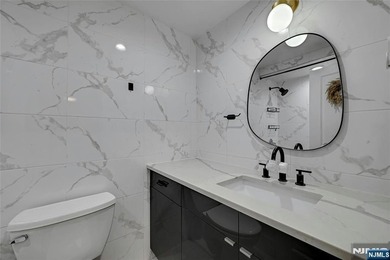 This professionally updated 1-bedroom, first-floor unit at