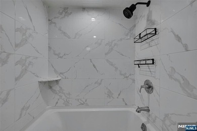 This professionally updated 1-bedroom, first-floor unit at