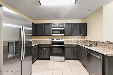 Experience modern living in this fully renovated 3BR/2BA condo - photo 3