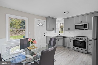 Welcome home to this beautifully renovated expanded Cape Cod - photo 14