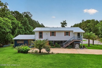 uTucked away on three beautifully landscaped lots, this - photo 2