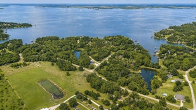 Peaceful .65 Acre Homesite with Boat Ramp Access in April Cove - photo 34