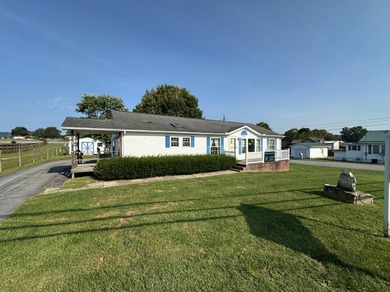 Inviting one-level home situated on a spacious corner lot with a