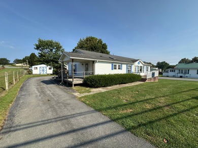 Inviting one-level home situated on a spacious corner lot with a