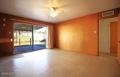 This charming single-level brick home in the highly desirable