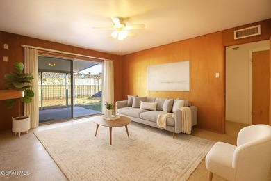 This charming single-level brick home in the highly desirable