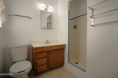 This charming single-level brick home in the highly desirable