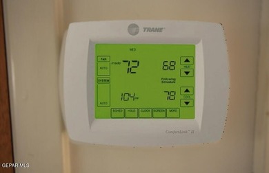 This charming single-level brick home in the highly desirable