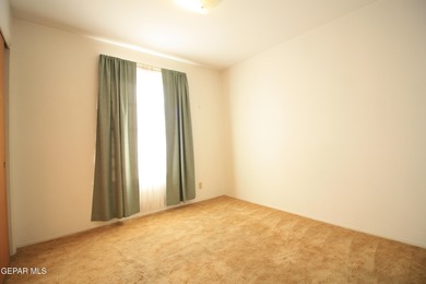 This charming single-level brick home in the highly desirable