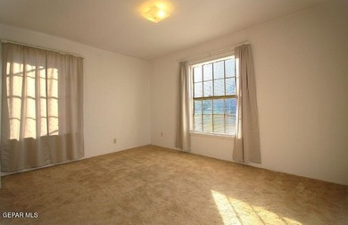 This charming single-level brick home in the highly desirable