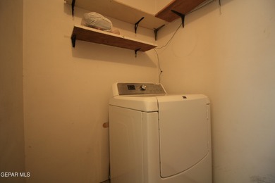 This charming single-level brick home in the highly desirable