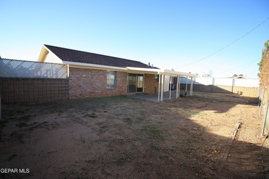 This charming single-level brick home in the highly desirable