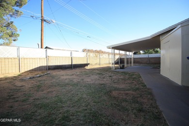 This charming single-level brick home in the highly desirable